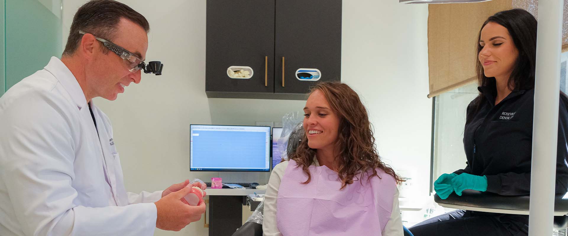 A patient consultation discussing Invisalign clear aligners at Roseville Dental Company in Roseville CA.